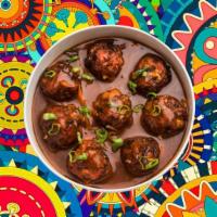 Curried Cauli-Bites · Cauliflower flowerets, seasoned, batter fried and sauteed with green onions and an Indo-Chin...