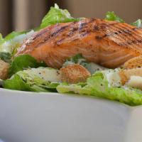 Broiled Salmon Over Caesar Salad · Filet of Salmon served over our Caesar Salad Tossed with our homemade Caesar Dressing.