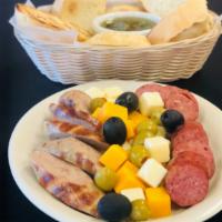 La Picadita · Chorizo sampler plate with and assortment of olives, cheese and artichoke.