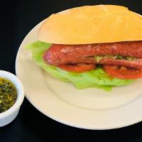 Chori Pan · Delicious chorizo sandwich with mayo, mustard, onions, tomatoes and lettuce sparked with our...