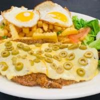 Milanesa Con Mozzarella Y Oliva · Milanesa topped with mozzarella cheese and olives and with two fried eggs.