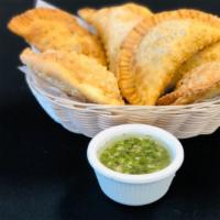 Empanadas · Homemade empanadas straight from river plate one containing ham, cheese, and the other conta...