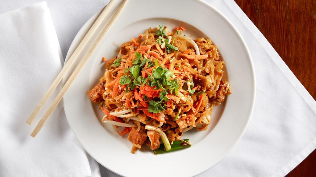 Pad Thai · Rice noodle stir fried with egg, green onion, and bean sprouts, and served with chunky peanut and lime.