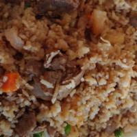 House Fried Rice · Served with carrot, green pea & onion.