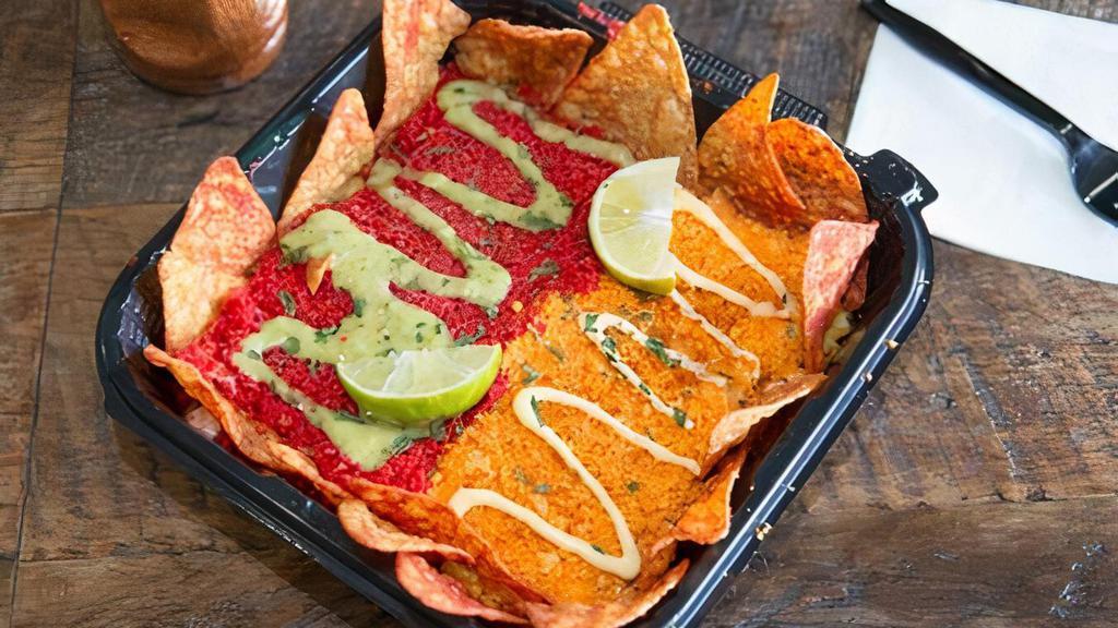Cheetos Elotes Duo Combo · Grilled corn topped with mayonnaise, cotija cheese, dusted with red Chile powder. Topped with cheddar jalapeño and xxtra flaming hot Cheetos. Served with lime wedges and Doritos. Perfect for sharing!