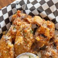 Crispy Chicken Wings · Six piece crispy chicken wings tossed in a house made sauce of your choice. Halal Chicken Wi...