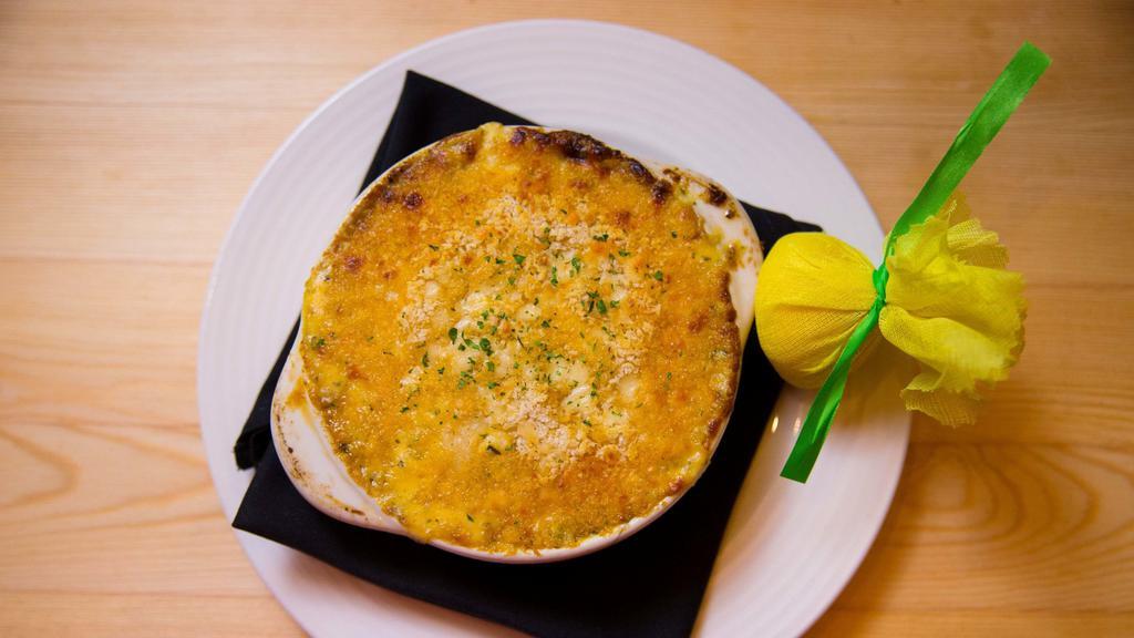 Lobster Cargot · Oven baked with butter, garlic and lobster cream sauce.