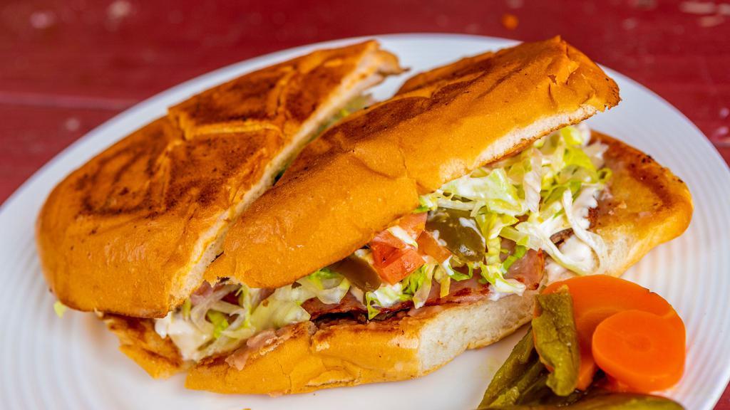 Tortas · With choice of meat, cheese, bean, lettuce, tomato, avocado, jalapeños, and crema. Served with lettuce, tomato, onions, mayonnaise, ketchup, pickles, mustard, and French fries.