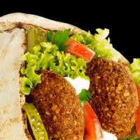 Falafel Wrap · Falafel on pita bread with salad, lettuce, tomato, cucumbers, pickles, tzatziki sauce, and h...