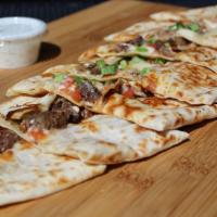 Adana Kabab Pide · Beef and lamb kabab with onions.