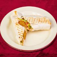 Falafel Wrap Sandwich Funky · Falafel wrapped in tortilla bread, potato, pickles, salad, and tahini sauce.