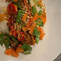 Orange Chicken Rice Bowl · lightly fried chicken, house made orange sauce, carrots,
snap peas, crushed peanuts