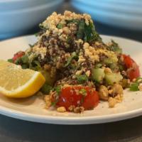 Quinoa Salad · Mixture of red and white quinoa, campari tomatoes, marcona almonds, garbanzo beans, cucumber...