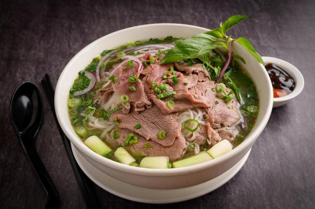 *Filet Mignon Phở · Noodle soup with FILET MIGNON BEEF. Soups are served with a plate of bean sprouts, fresh basil, sliced lime, and jalapeno. . Garnish:  cilantro , red onion , green onion