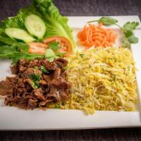 Shredded Beef Ribeye Fried Rice · Seasoned yellow garlic fried rice with shredded grilled beef , egg , onion, beansprout.. Gar...