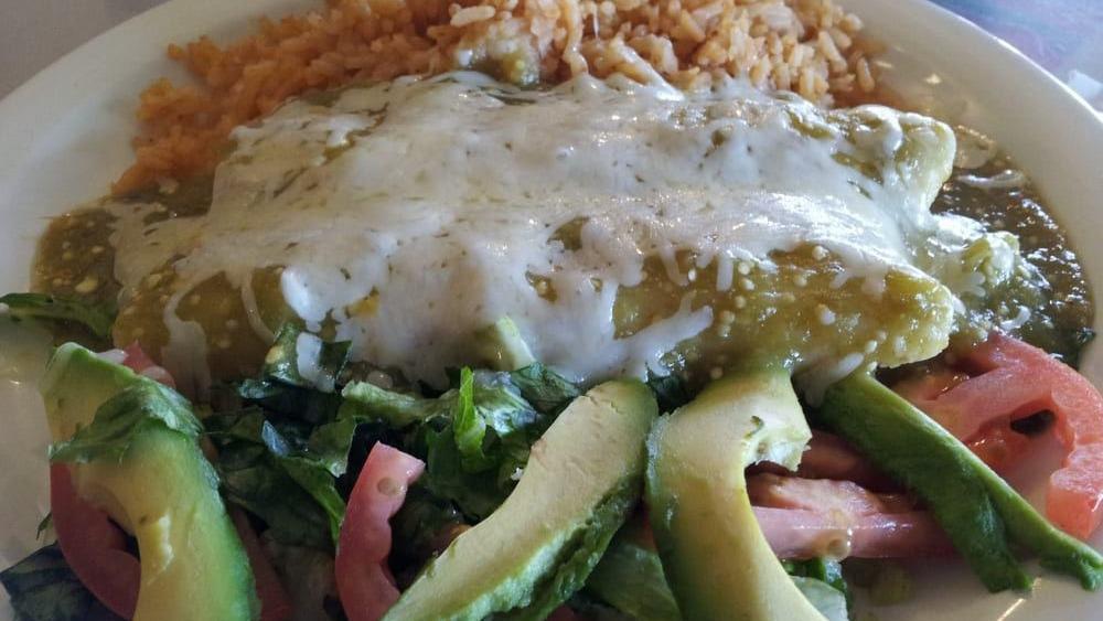 Galveston Enchiladas · Two shrimp and crab enchiladas topped with green sauce served with rice and avocado salad.
