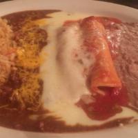 Enchiladas Rancheras · Two chicken or beef enchiladas topped with ranchera sauce served with rice and beans.