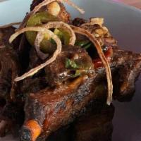 Pork Riblets · 1lb Pork Riblets coated with sweet & sour tamarind and topped with basil and pickled jalapen...