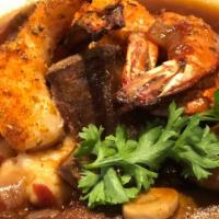 Sausage Shrimp And Grits · House-made Andouille sausage, gulf shrimp, and fried cheese grits. Paleo option: choose caul...