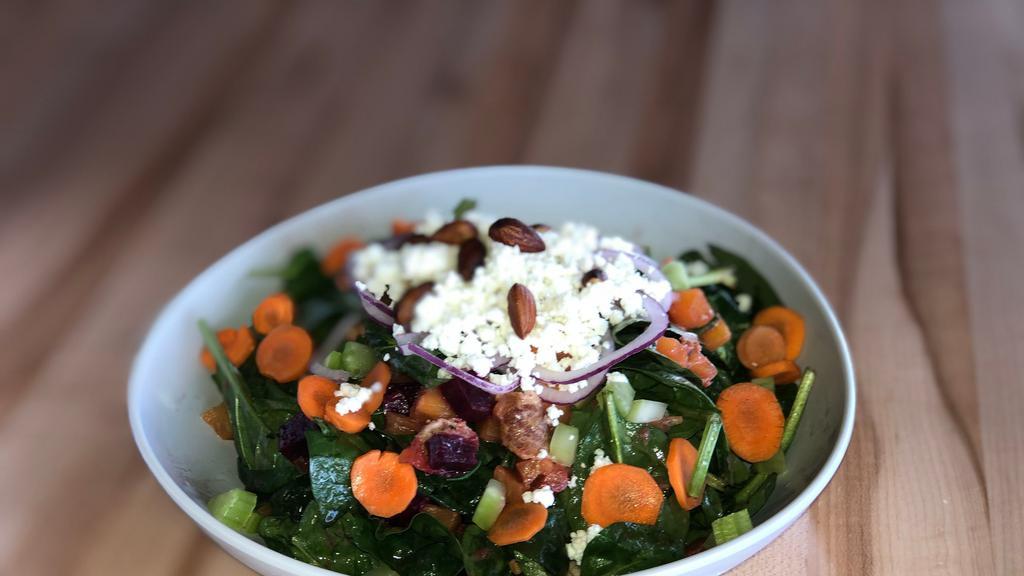 Spinach And Beet Salad · Spinach, red and golden beets, house-made bacon, celery, almond, carrot, goat cheese, red onion, basil, beet dressing, lime. Add protein for an additional charge.