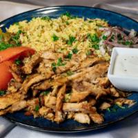 Chicken Carved Shawarma · Spit-roasted chicken breast and thigh, turmeric rice, roasted tomato, Persian pickles, sumac...