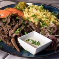Beef Carved Shawarma · Spit-roasted beef and lamb, turmeric rice, roasted tomato, Persian pickles, sumac onion, tah...