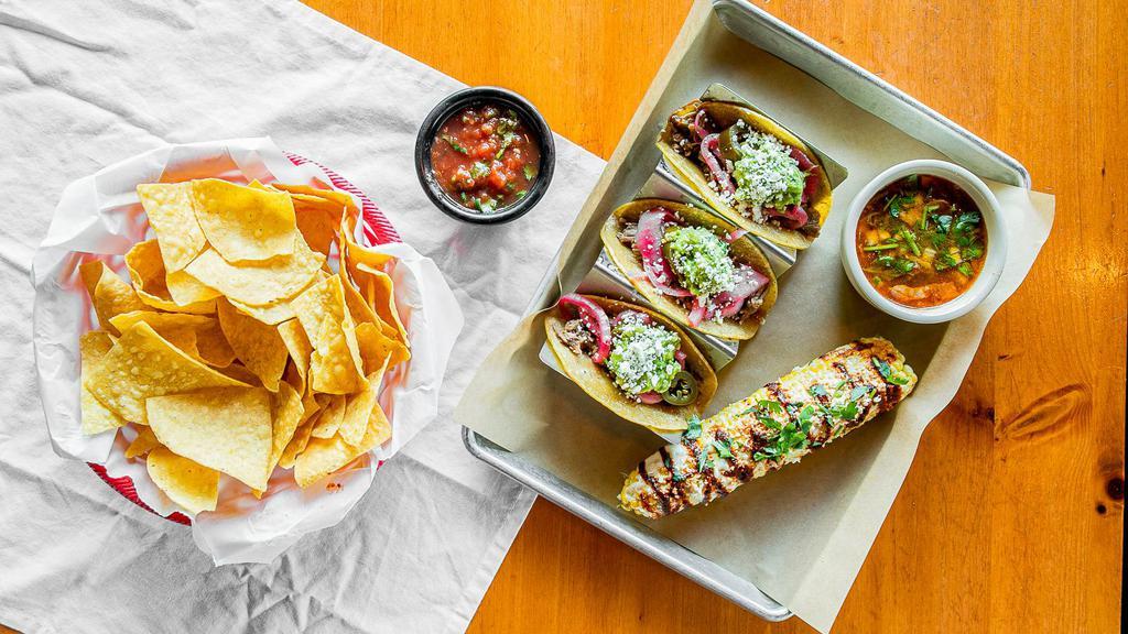 Brisket Taco · Oven-roasted brisket topped with pickled onions, jalapeños, guacamole, queso fresco. Served on corn tortillas. Served with two sides.