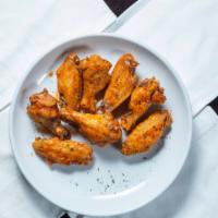 Chicken Wings · Cooked wing of a chicken coated in seasoning.