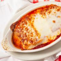 Lasagna · Pasta layered with beef and ricotta cheese, topped with marinara sauce and mozzarella cheese.