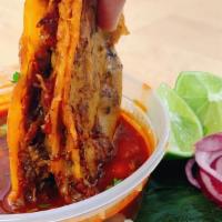 Beef Birria Tacos · Three corn tortilla tacos bathed in consommé stuffed with juicy tender beef, cheese and gril...