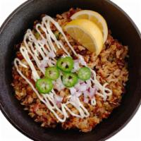 Lechon Kawali Sisig · Tasty, chopped & seasoned pork belly with a little kick and drizzled with a creamy mayo. Doe...