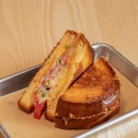 Fancy Grilled Cheese · Roma tomatoes, pickled onion, red bell pepper, green onion & beer cheese queso with sweet ch...