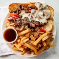 Guinness Cheese Steak · Guinness braised ribeye, sautéed mushrooms, peppers, caramelized onions, Swiss cheese on a t...