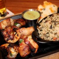 Bacon Wrapped Shrimp · Six large shrimp stuffed with jack cheese and grilled jalapeno, wrapped in hickory smoked ba...