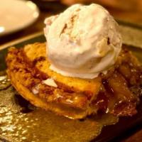 American Apple Pie · Classic apple pie topped with a buttered Kentucky bourbon sauce and henry's homemade ice cre...