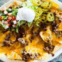 Nacho Supreme · Customer favorites. Served with sour cream, jalapenos, and pico with your choice of meat (ch...