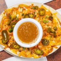 Chicken Or Steak Fajita Nachos · Choice of meat, cheese, bell peppers, onions, pico de gallo, jalapenos, and side of salsa.
