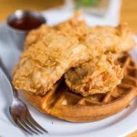 Chicken N' Waffles · Belgian Waffle topped with seasoned breaded chicken breast & pineapple chutney or maple syrup.