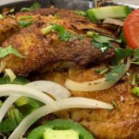 (Gr) Grilled Tilapia · Two tilapia fillets marinated with herbs and spices and then grilled. Served sizzling with a...