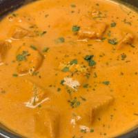 (Cn) Chicken Tikka Masala · Tandoor-roasted chicken kebab pieces sauteed in creamy tomato- and paprika-rich sauce and ga...