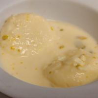 (De) Ras Malai · Chana balls soaked with cheese in thick sweet cream, boiled, then flavoured with cardamom an...