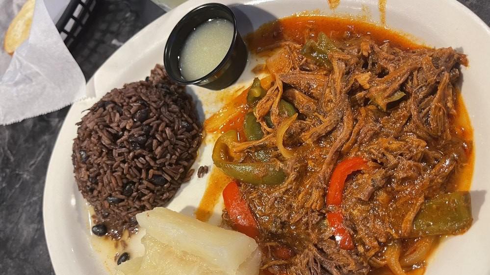 Ropa Vieja · Shredded beef cooked in tomato sauce, with red and green peppers and onion. Served with fried plantains and your choice of black beans and rice mixed together or rice and beans served apart.