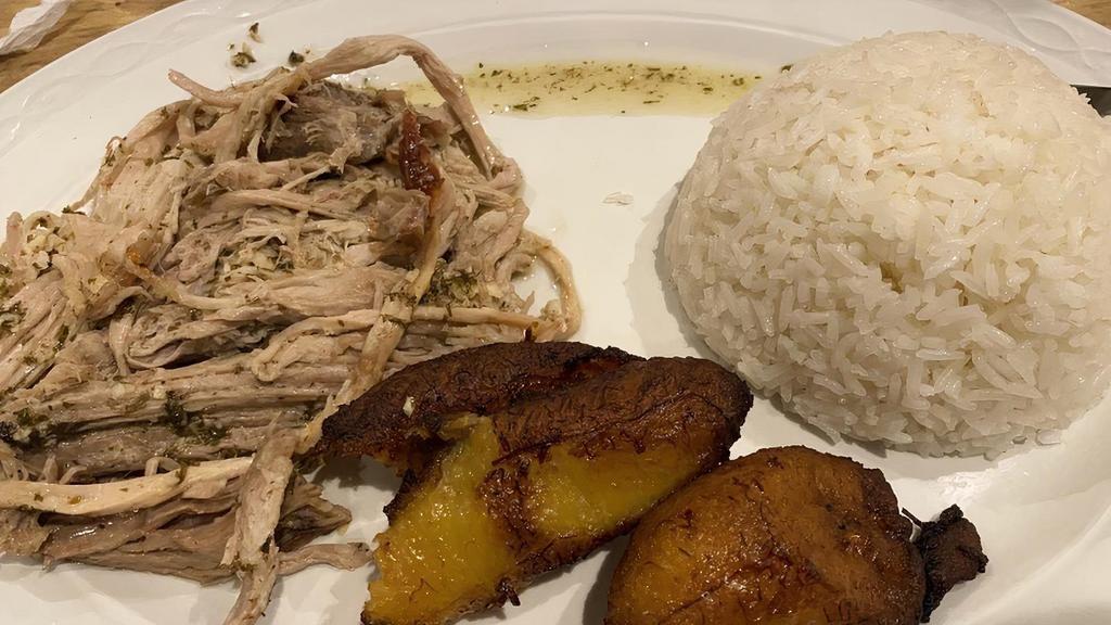 Puerco Asado · Roasted pork. Served with fried plantains and your choice of black beans and rice mixed together or rice and beans served apart.