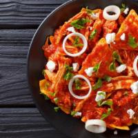Chilaquiles · Corn tortilla pieces that are fried, cooked in salsa, and sprinkled with cheese and topped w...