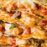 Shrimp Quesadilla · Three flour tortillas filled with house seasoned grilled shrimp and melted cheese, topped wi...