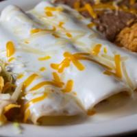 One Beef, One Cheese Enchilada, & One Chicken Enchiladas  · Topped with chile con carne sauce and chicken enchilada topped with sour cream sauce.