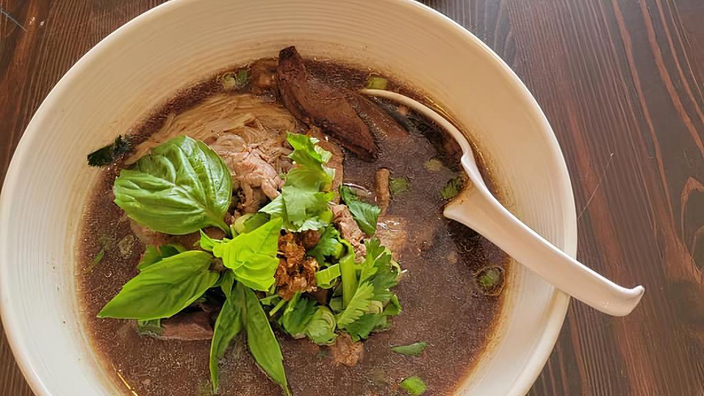 Combination Beef Noodle Soup · Sliced beef, meatballs, beef liver, bean sprouts in thick beef blood broth topped with onions, cilantro and garlic oil.
