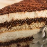 Tiramisu Cake (1) · One piece. Two layers of sponge cake soaked in tiramisu flavored sauce are layered with crea...