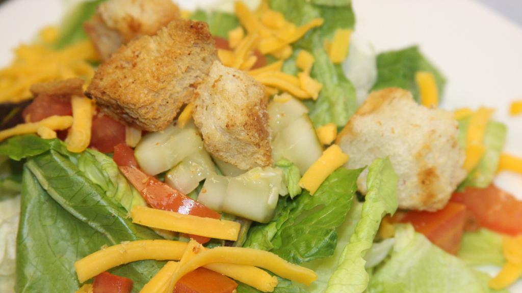Small Garden Salad · Mixed greens, diced tomatoes, cucumbers, croutons and cheddar cheese.