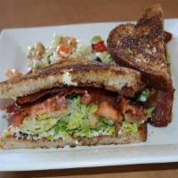 Blt · Crispy bacon, lettuce, tomatoes, and basil mayo on toasted wheat bread.